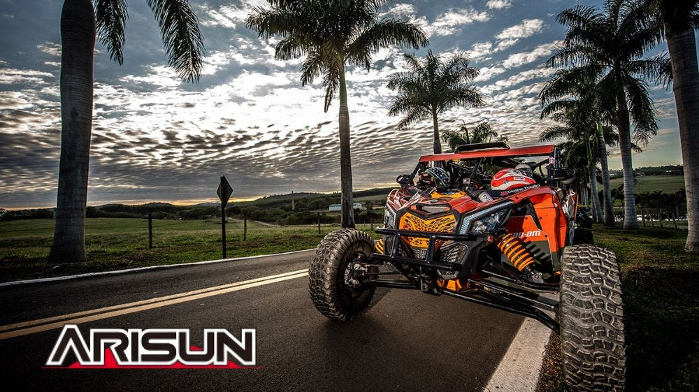 UTV with Arisun tires at sunset with Arisun tire logo