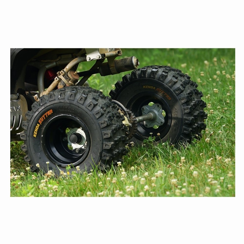 Close up view of the rear tires of an ATV showing Kenda Kutter XC tires