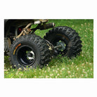 Close up view of the rear tires of an ATV showing Kenda Kutter XC tires