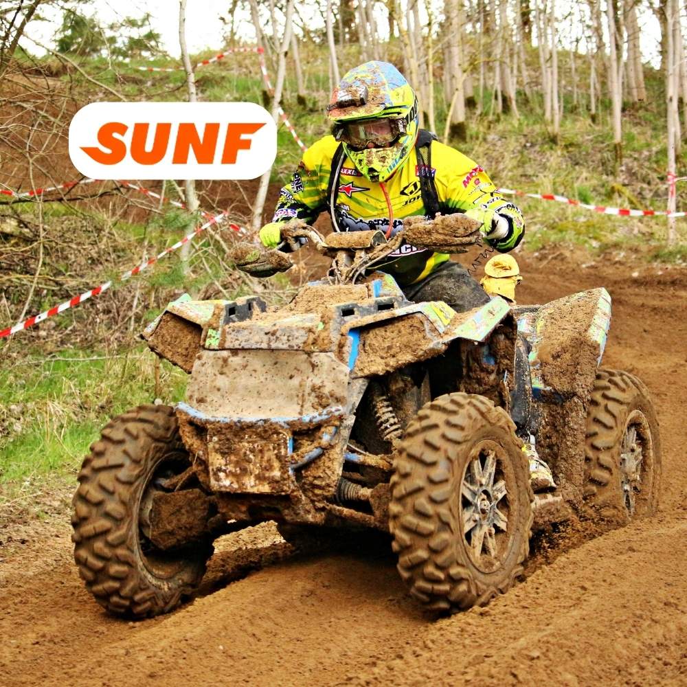 ATV driving though mud with SUNF Tire logo