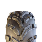 Close up view of the tread and casing details on the 440 Mag ATV and UTV tire, showcasing the alternating angled lugs with lug pockets designed to clear water, mud, and debris.