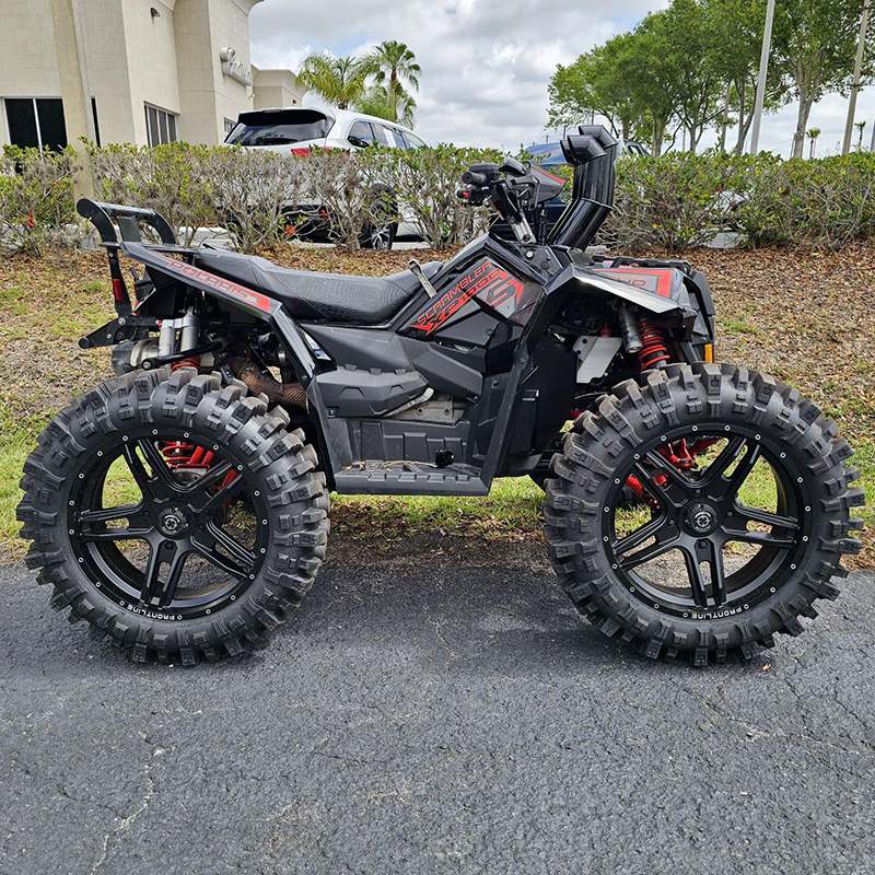 Matte black Frontline 505 wheels installed and mounted on a Polaris Scrambler XP100 quad atv.