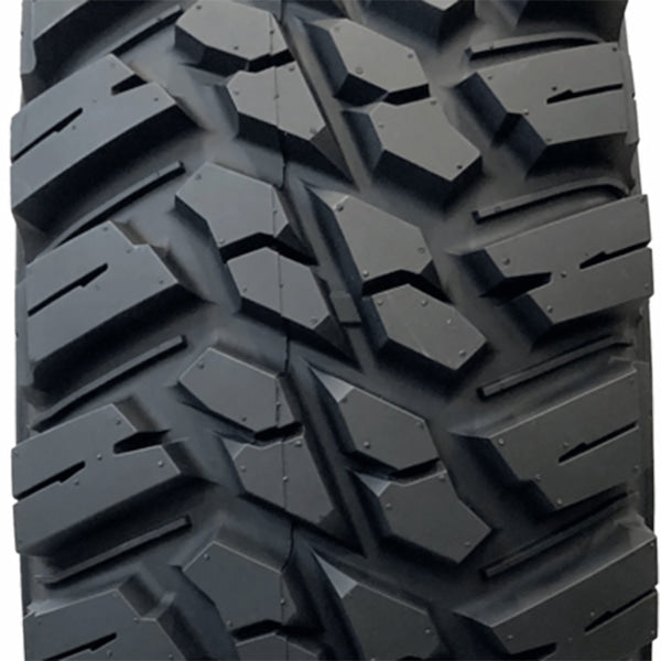 Close up view of Mongrel SQ tire tread showing square shoulder block design.