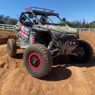 XComp R/S tires mounted on Polaris RZR racing SXS with beadlock 15" rims, parked on race course.