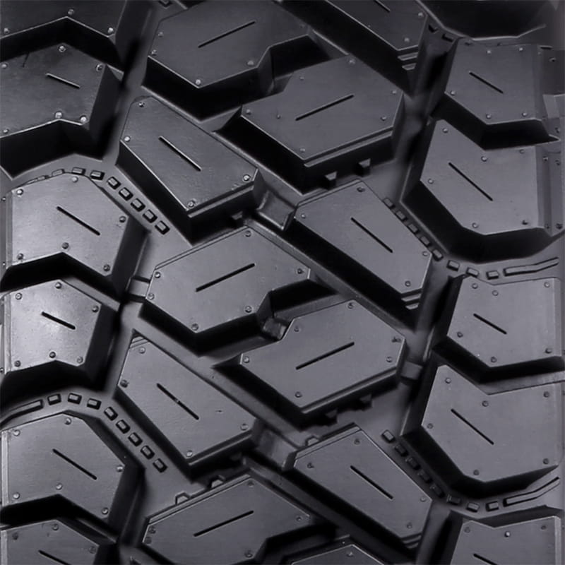 Detailed close-up view of the tread design and lug block details of the Intersect UTV tire by ITP Tire.