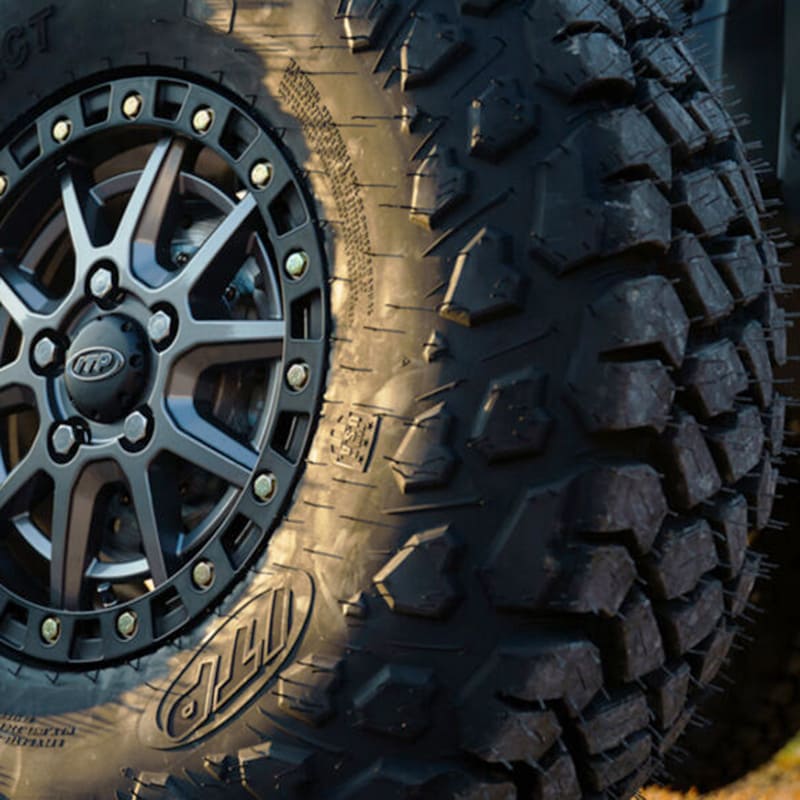 ITP Intersect all-terrain 8-ply radial tire mounted on ITP wheel on SxS.