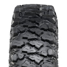 Close up detailed view of the multi-angled lug design and non-directional tread pattern of the Savage XT tire, including diamond textured casing profile between the lugs to promote mud self-cleaning and enhance grip in all conditions, and triangle stepped lug bases to eliminate dirt and mud build-up between the center lugs.