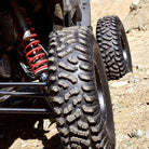 Detailed view of Terra Hook radial tire installed on sxs in hard pack terrain.