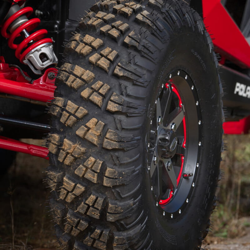 Close up of Versa Cross V3 all terrain tire by ITP installed and mounted on Polaris RZR side-by-side.