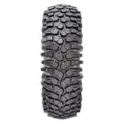 Detailed view of the aggressive rock crawling tread pattern and tread block lug design of the 8-ply standard and competition sticky Maxxis Roxxzilla UTV and SXS radial tire, featuring alternating staggered shoulder lugs for rock traction.