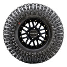 Sidewall view of a mounted Roxxzilla radial rock and desert tire showing the reinforced sidewall lug design and color branded Maxxis logo, available in 14", 15", and 17" wheel sizes.