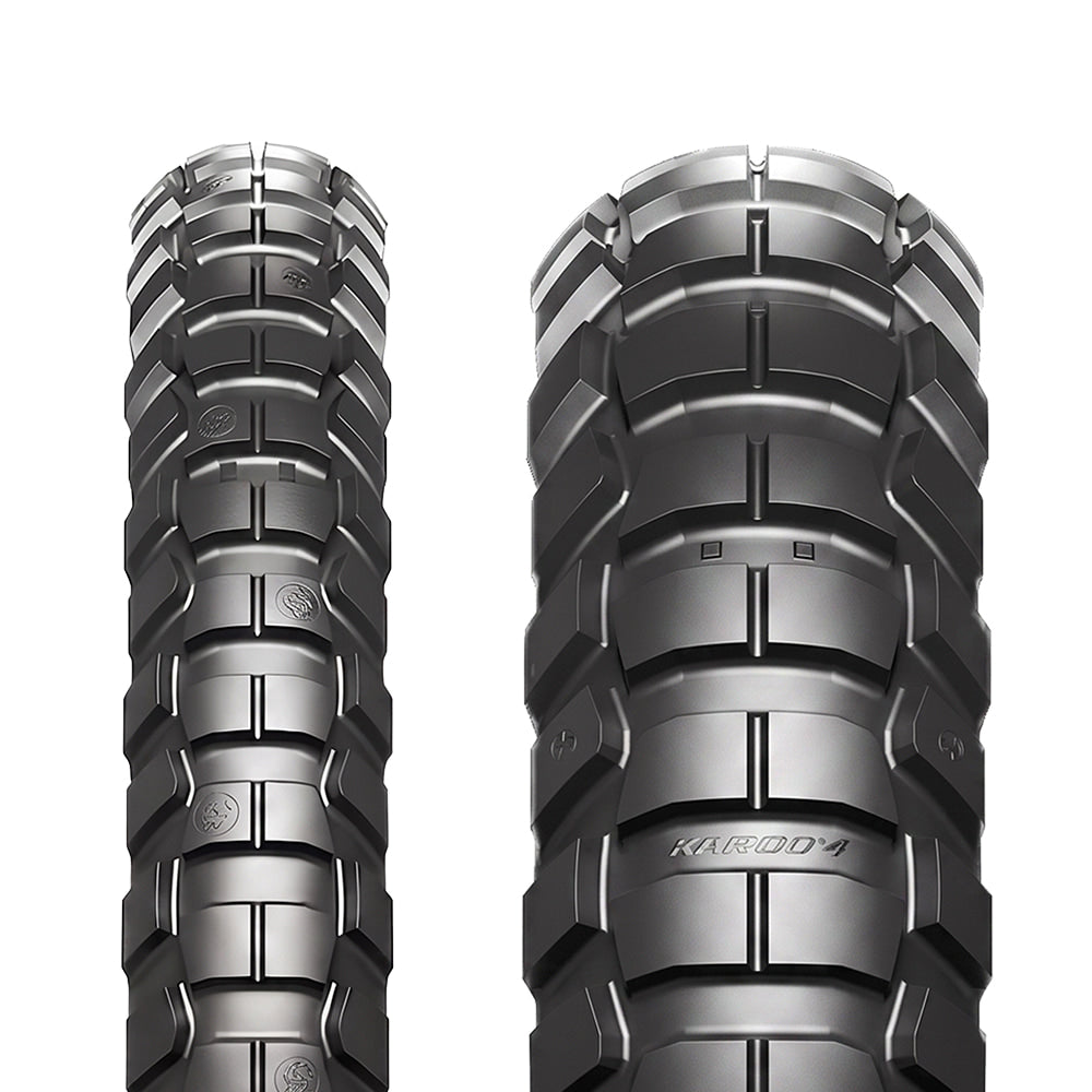Close up detailed tread pattern view of both the front and rear Metzeler Karoo 4 ADV and Moto tires, featuring the patented multi-pitch knob lug design, transversal layout, and Dymatec Mould Angle Technology for optimized tread wear resistance.