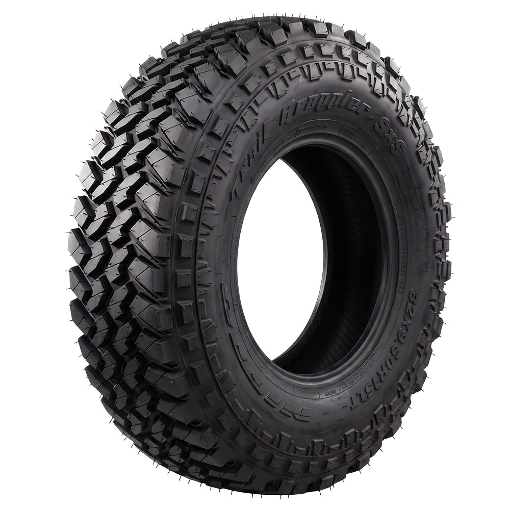 Angled high quality image of the Nitto Trail Grappler SXS 33x9.50R15LT Off-Road Tire for Side-by-Sides and UTV, featuring automotive grade segmented mold light truck steel belted radial construction, and offered with free shipping, part # N207-970.