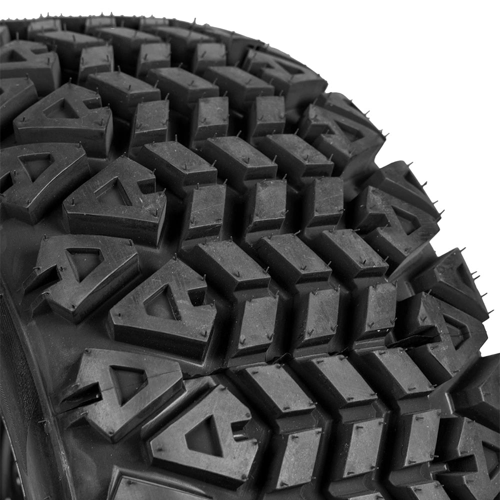 Close up detailed view of the tread pattern and lug design of the durable RTV and UTV airless OTR NDX 350 Mag tire, featuring a classic all-terrain design for great traction and treadlife.