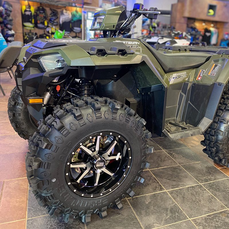 Frontline 556 black/machined wheel and ACP tire combo installed on Polaris Sportsman AWD quad atv.