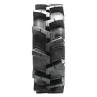 Full tread pattern and lug design view of the QBT608 UTV and SXS tire by Quadboss with tough Bias 6-ply construction and continuous center tread to improve road ride and noise, with aggressive ag lug style angled tread bars.