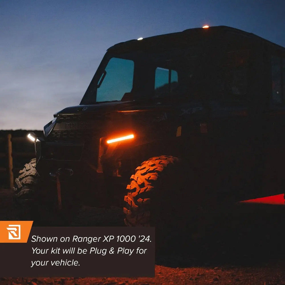 Example photo of the Ravek light kits installed on a Polaris Ranger XP 1000 at night, showcasing the ability to switch between white lighting and amber.