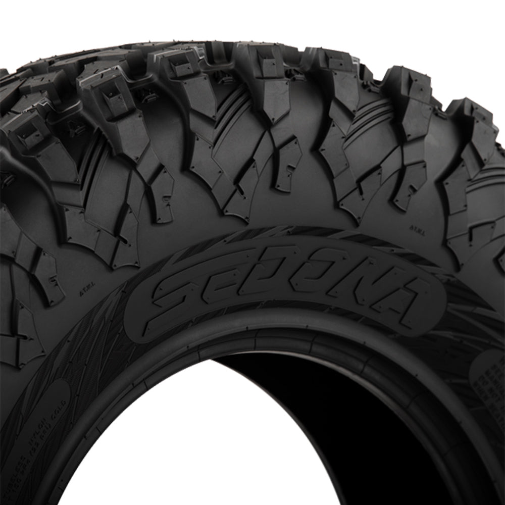 Close up detailed view of the wrap-around shoulder lug and sidewall design of the Sedona Ridge RIPR UTV tire, including a great view of the Sedona logo molded into the tire's sidewall.