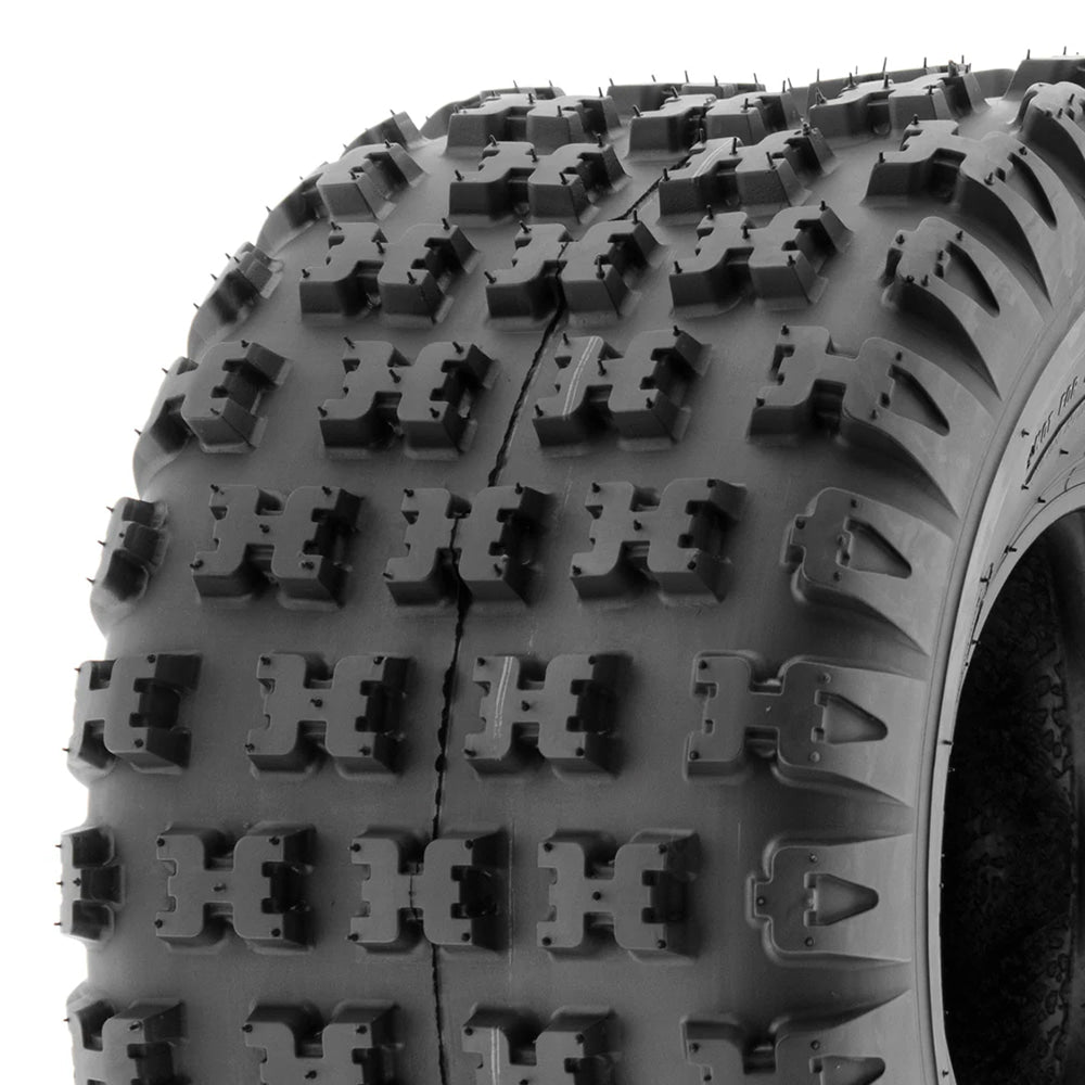 Close up view of the "H" style tread blocks / knobs of the A031 SunF Quad and ATV rear tire, displaying multiple biting edges for top traction and moderate side slide for high speed cornering capabilities, sold with free shipping by ROD Tire.