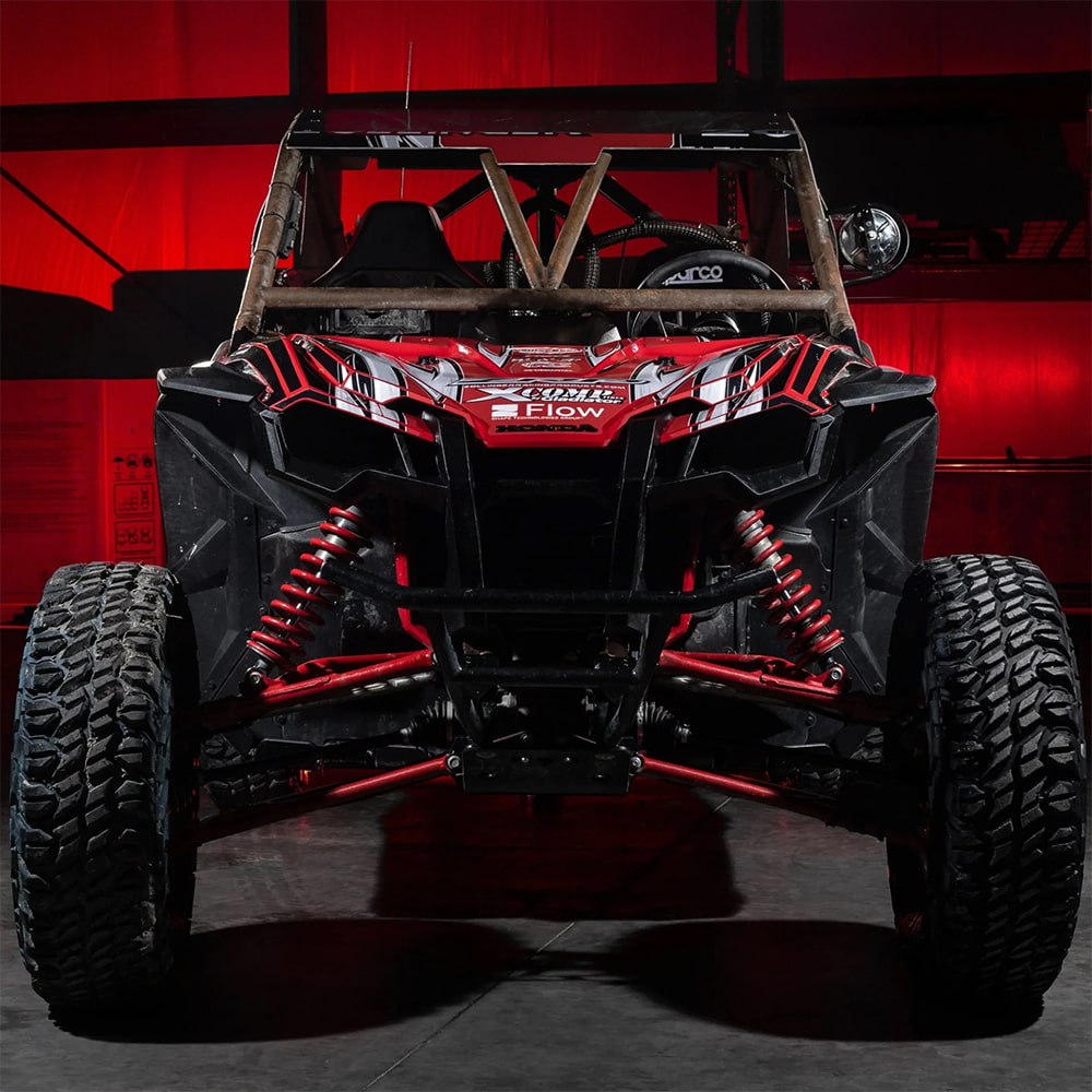 Front view of a Honda racing SxS with Xcomp ATR tires installed.