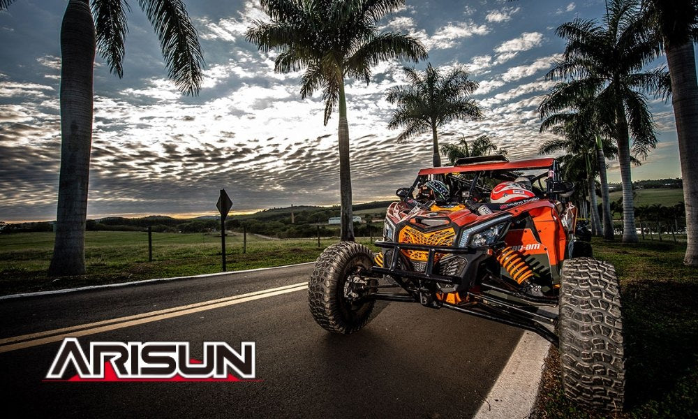 UTV with Arisun tires at sunset with Arisun tire logo