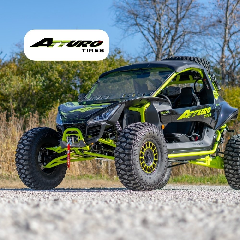 UTV with Atturo tires on gravel terrain. Atturo Tires logo placed on image.