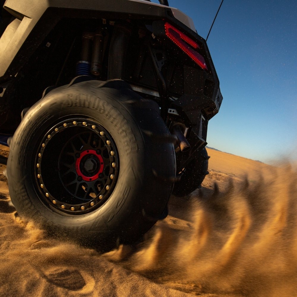 EFX Sandslinger rear tire in action on sandy terrain