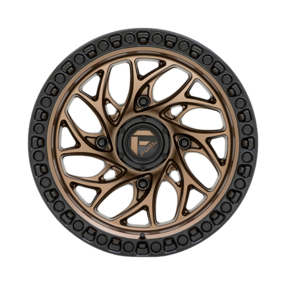 A multi-spoke Fuel UTV Runner UTV wheel rim with a bronze finish and a black simulated bead ring outer edge, featuring a central black hubcap with a gold 'FUEL' logo.