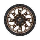 A multi-spoke Fuel UTV Runner UTV wheel rim with a bronze finish and a black simulated bead ring outer edge, featuring a central black hubcap with a gold 'FUEL' logo.