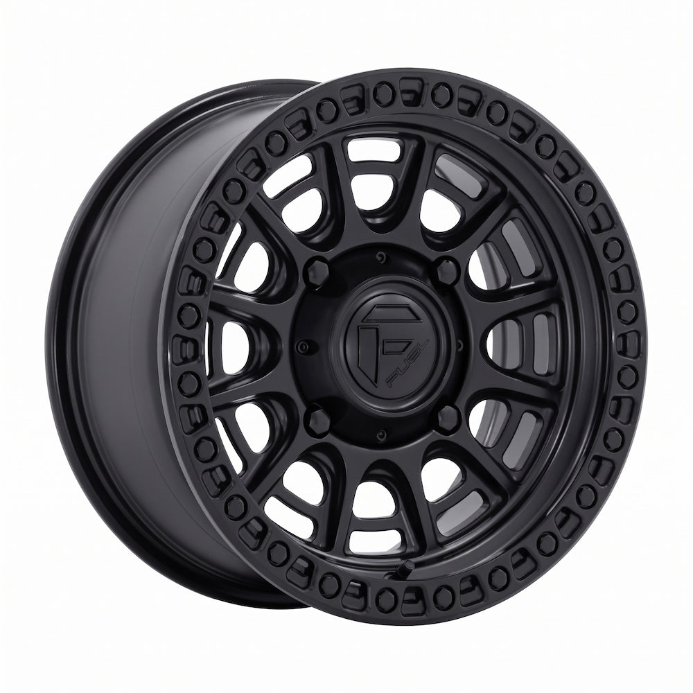 A single matte black with gloss black lip Fuel Cycle FV832 UTV wheel shown at a three-quarter angle on a plain white background.