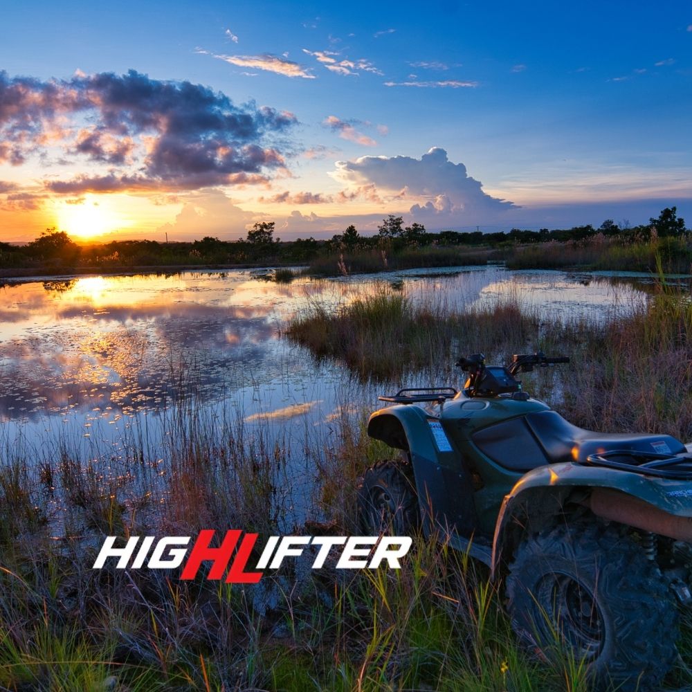 ATV in a bog/swamp with High Lifter Logo overlay