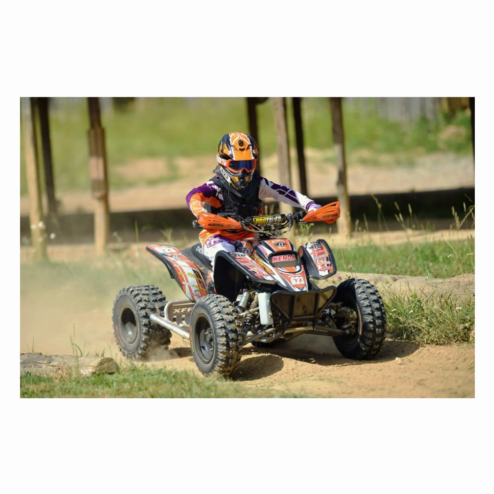 ATV rider racing with Kenda Kutter XC Tires