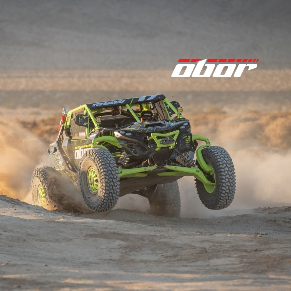 UTV driving through the desert with Obor tires and logos. Obor logo imprinted onto image.