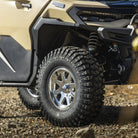 Close up of a front tire UTV with Sedona Rock-a-Billy tires and chrome wheels