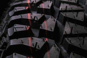 Close-up of the Valor Tango UTV tire tread pattern on a black background