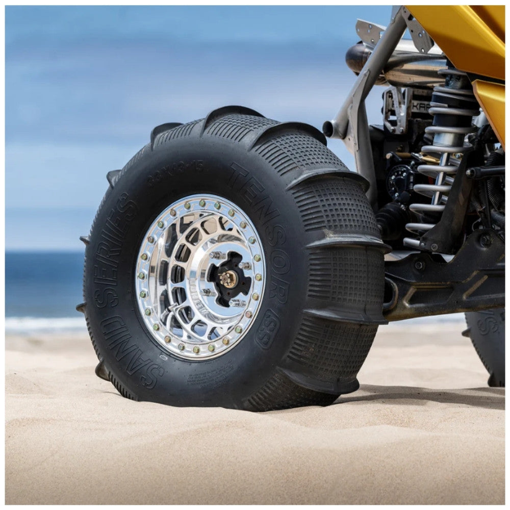 Close up of Tensor Sand Series rear tire on a UTV on sand