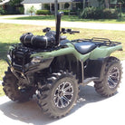 Interforce tires installed on ATV quad parked on driveway in yard.