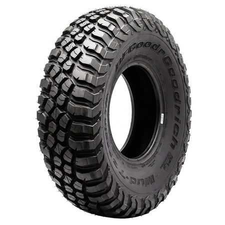 Angled view of the popular and proven steel belted radial Baja Champion BFGoodrich KM3 Mud Terrain T/A tire designed for high performance SXS and UTV models, featuring Traction Armor Sidewall Sculpting to protect against sidewall splitting, offered with fast and free shipping and 6-year manufacturer's limited warranty, all sizes feature fast and free shipping.