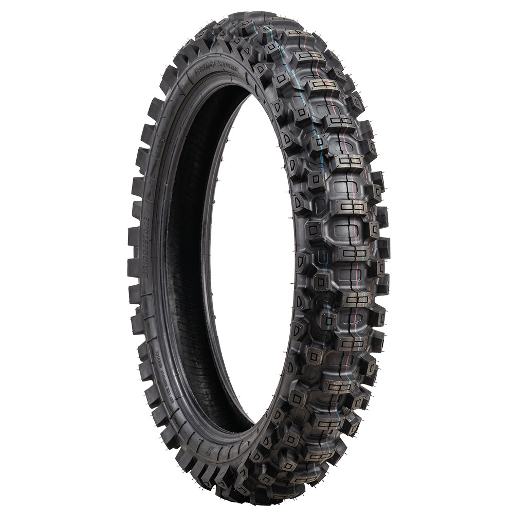 Angled view of the Bridgestone Battlecross X31 adv/dual-sport and off-road motorcycle rear tire, designed to be a true intermediate tire to excel in soft and hard terrain, featuring Bunker Groove technology and NHS rated in most popular sizes, sold with fast and free shipping.