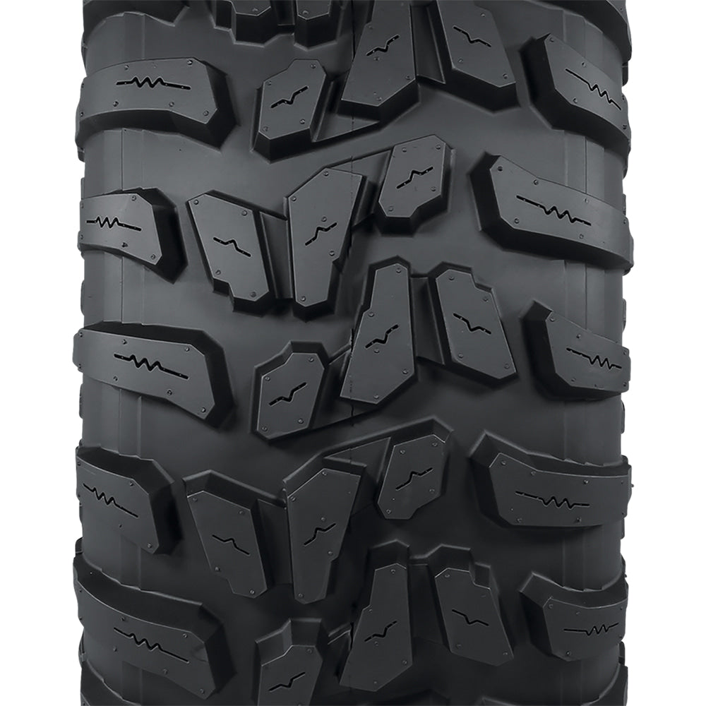 Close up view of the tread pattern and lug design with connecting centerline base block for extended wear and control, featuring block siping for added wet traction, and a high traction all terrain design, great for worksites, hard surfaces, and gravel.