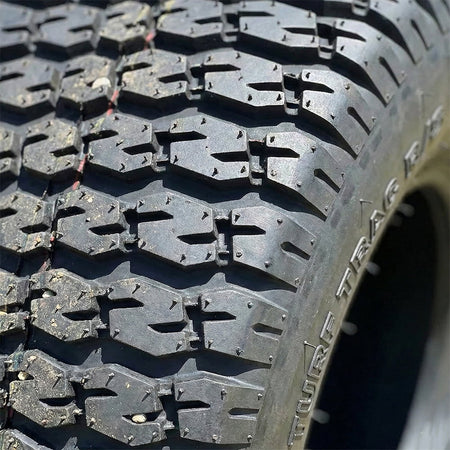 Close up detailed view of the tread pattern and "s-lug" design featured on the Carlisle Turf Trac R/S lawn tire lineup, offering great traction, lawn friendly design, and long lasting tread life.