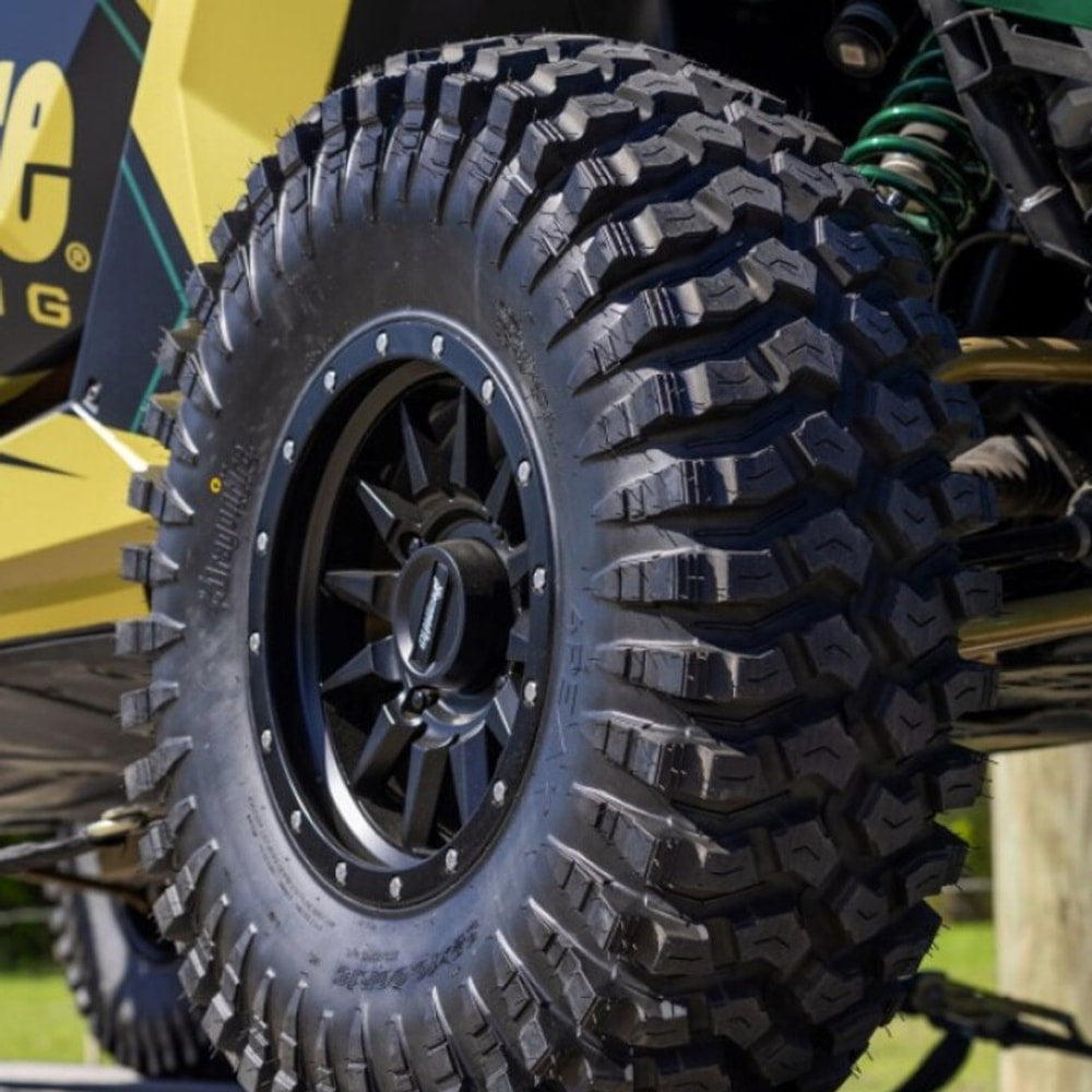 DragonFire 4Peak tire mounted on aftermarket aluminum rim installed on racing sxs.
