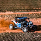 Broad Peak race inspired radial tires drifting around track on side by side.