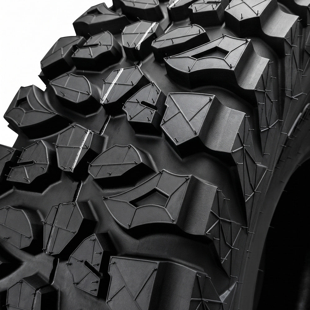 Close up detailed tread pattern view of the Forerunner X-Trekker UTV all-terrain tire featuring assymmetrical tread blocks an pocketed shoulder lug design.