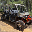 Black and machined aluminum finish 505 model UTV wheels mounted on Can-Am Defender UTV, parked on trail.