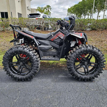 Matte black Frontline 505 wheels installed and mounted on a Polaris Scrambler XP100 quad atv.