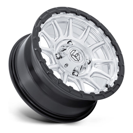Fuel Piston FV866 UTV wheel in hyper silver machined with matte black lip, side angle showing the barrel and lip