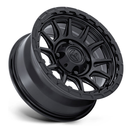 Fuel Piston FV866 UTV wheel in matte black with gloss black lip, side angle showing the barrel and lip