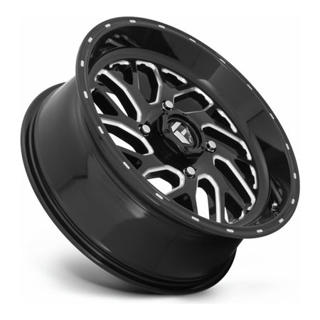 Fuel Triton D581 UTV wheel in gloss black milled, side angle showing the barrel and lip