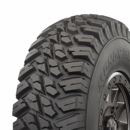 Angled tread view and shoulder blocks of Mongrel SQ sport tire.